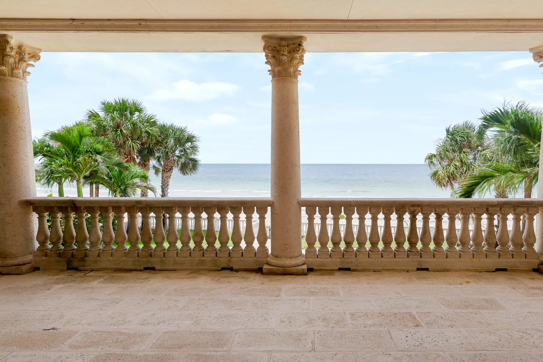 Covered waterfront terrace photographed for a Tampa Bay luxury listing