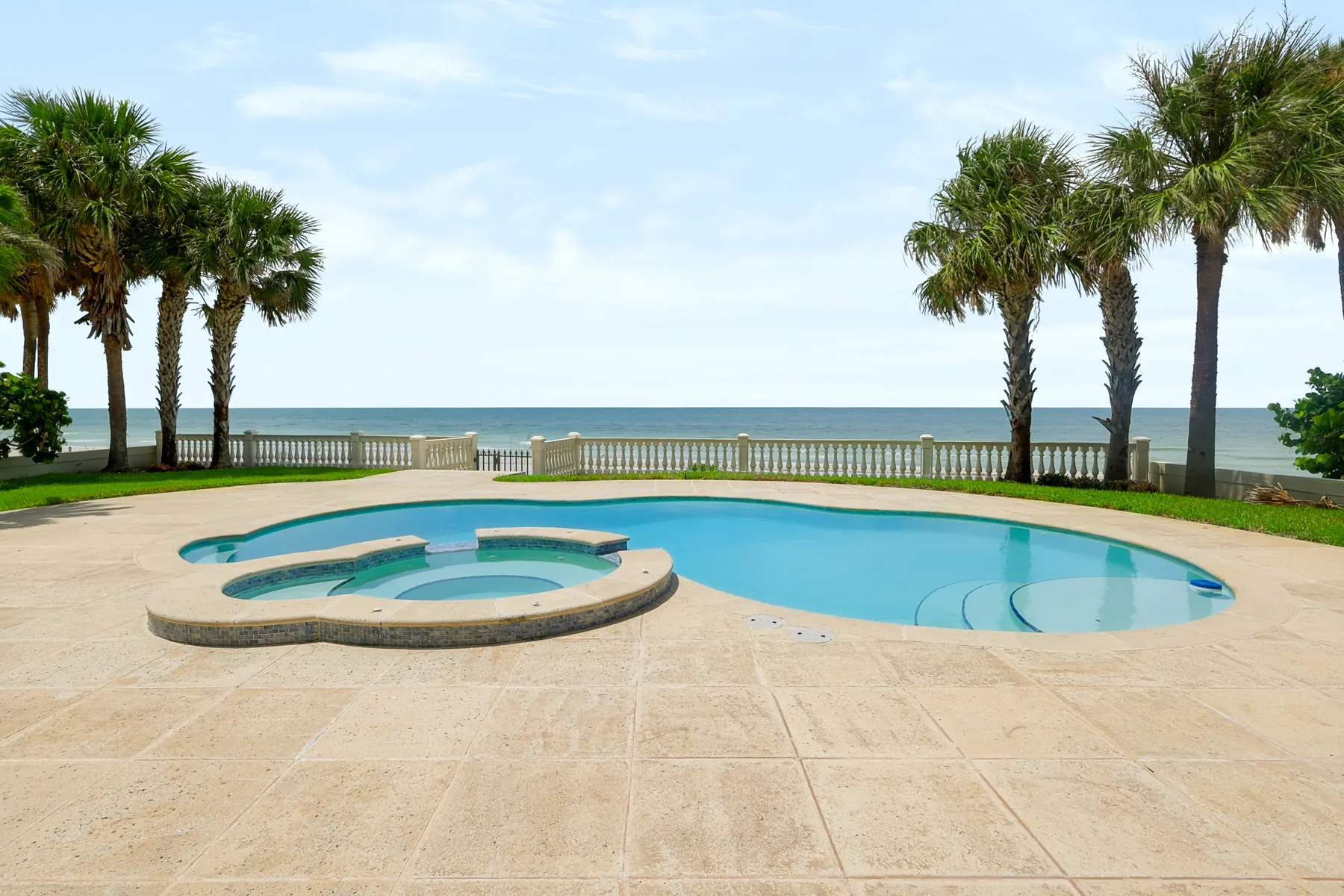 Wide waterfront pool scene photographed for a Tampa Bay luxury property listing