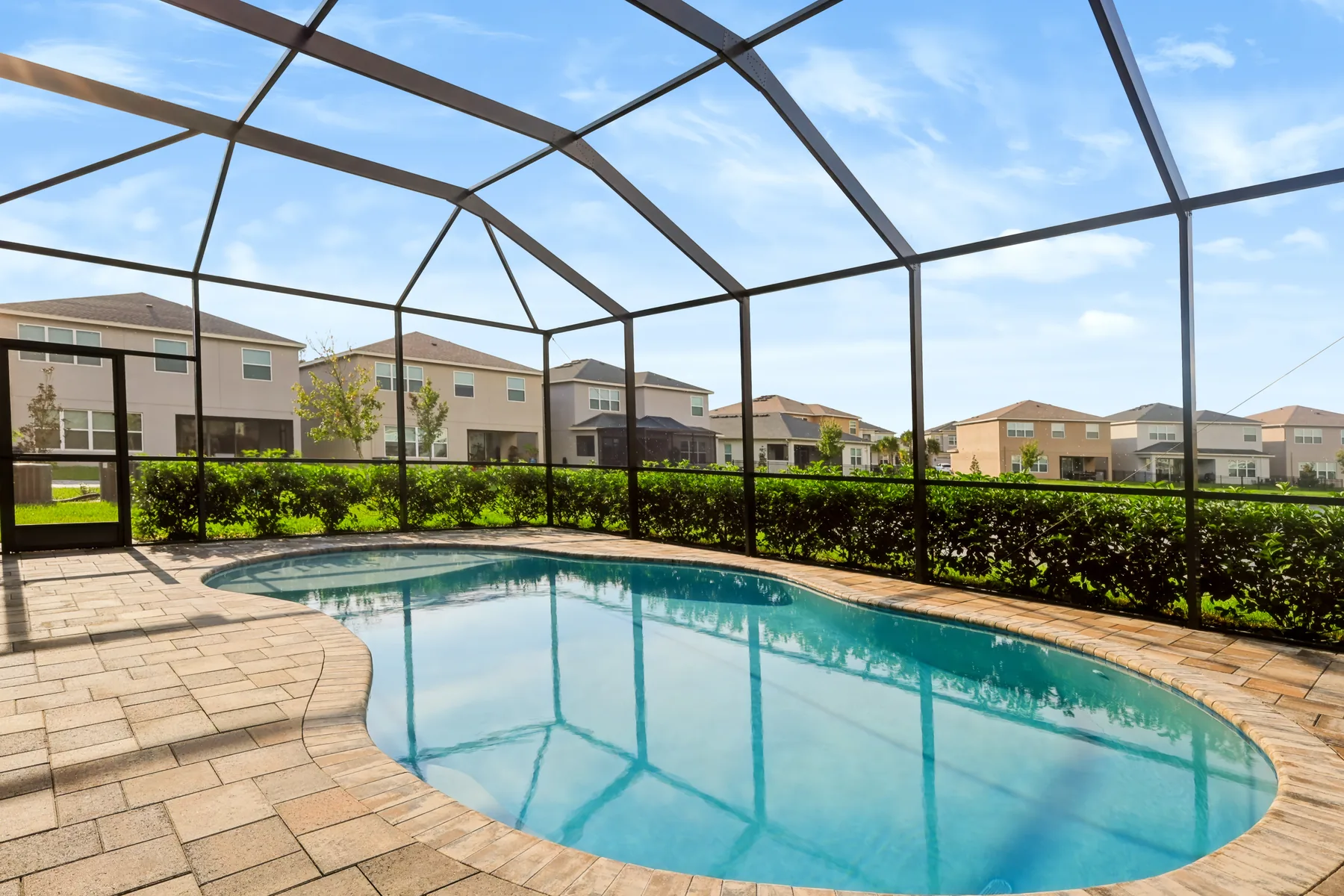 Screened pool and patio photographed for a Tampa Bay home listing